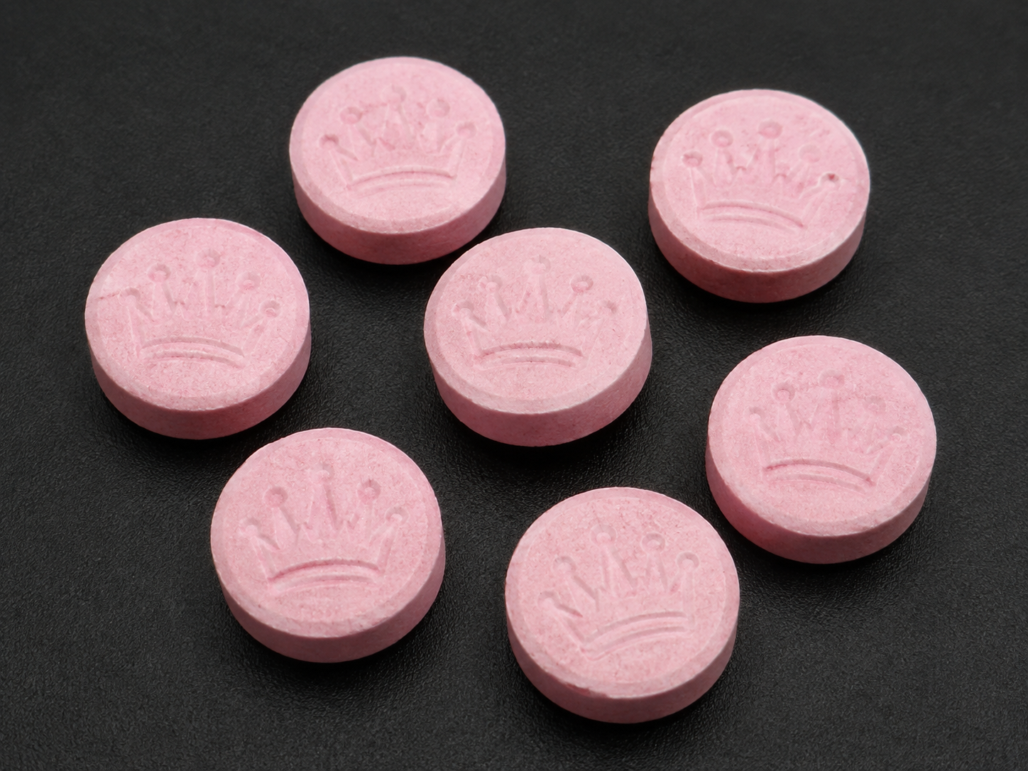 Fictional pale pink crown-pressed Nova tablets